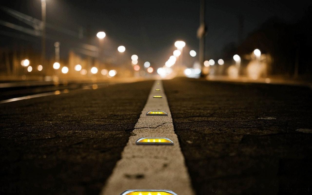 Road safety reflectors installed on highway for night visibility and traffic safety